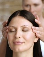 therapist uses acupressure on temples of subject, from www.nicolewithrow.com